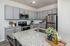 furnished kitchen with island in home