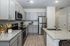 furnished kitchen with island in home