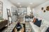 furnished kitchen and living area of home