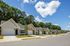 row of single-family houses and street on sunny day