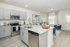 furnished kitchen and living area of home