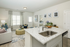 furnished kitchen and living area of home