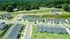 aerial shot of neighborhood of homes on sunny day