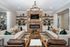 furnished clubroom with seating and fireplace