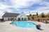 exterior pool with building on sunny day