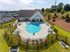 exterior pool with building on sunny day
