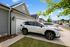 exterior sunny day vehicles parked in drive way