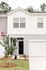 Exterior of townhome buildings with landscaping in front
