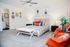 Furnished and decorated bedroom with plush carpeting