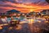 Charming community pool area with elegant seating and vibrant sunset view, perfect for relaxing evenings.