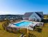 Exterior view of townhome community with swimming pool and clubhouse