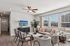 Bright and modern living room with elegant furnishings, large windows, and stylish decor, offering a warm and inviting atmosphere.