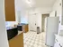 Charming kitchen featuring modern appliances, ample storage, and natural light.