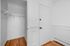 Inviting entryway with elegant hardwood floors and a spacious coat closet, welcoming you home with style.