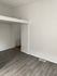 Bright and airy room with elegant wood flooring and fresh white walls, perfect for creative interior design.