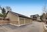 Charming residential garages with seamless integration into a townhouse community, emphasizing convenience and accessibility.