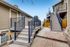Elegant entrance to a modern duplex with clean architecture and inviting stairways.