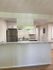 Modern kitchen with sleek stainless steel appliances, elegant countertop, and contemporary cabinetry.