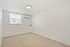 Bright, spacious room with plush carpeting and modern air conditioning, ideal for a cozy retreat.