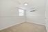 Bright and airy room with plush carpeting and modern air conditioning, perfect for a cozy retreat.
