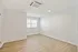Bright and airy empty room with sleek hardwood floors and a large window, perfect for customizing your dream space.