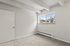 Bright and airy room with large window offering scenic outside views, perfect for peaceful living.