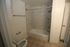 Modern bathroom with elegant marble tile shower and sleek fixtures, offering a serene and stylish retreat.