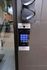 Modern and secure building entrance featuring a sleek digital intercom system with keypad and camera for convenient access.