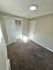 Bright and cozy room with plush carpeting and ample closet space, perfect for a peaceful retreat.