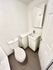 Contemporary bathroom with sleek fixtures, elegant sink, and modern tile flooring in a minimalistic design.