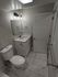 Elegant bathroom with modern fixtures, sleek vanity, and stylish marble floor.