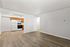 Bright and inviting kitchen area with wooden cabinetry, white appliances, and elegant flooring, perfect for a modern lifestyle.