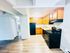 Bright and inviting kitchen with modern appliances, elegant wooden cabinets, and sleek flooring, perfect for culinary adventures.