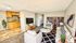 Inviting living room with cozy seating, stylish decor, and integrated kitchen area, perfect for relaxation and social gatherings.