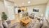 Inviting open-plan living space with modern kitchen, cozy seating area, and elegant decor, perfect for relaxation and entertaining.