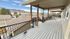Expansive covered balcony with scenic mountain views, perfect for outdoor relaxation.