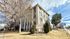 Charming Monte Vista apartment complex with modern architecture and a welcoming atmosphere, surrounded by mature trees and a serene suburban setting.
