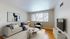 Bright and inviting living room with modern furniture, large window, and chic decor.