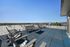 Rooftop terrace with lounge seating and panoramic mountain views at Flats on 70th at Midtown apartments in Westminster, CO
