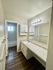 Spacious bathroom with elegant lighting and sleek countertop