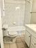 Bright bathroom with large tun and gorgeous tile