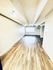 Bright open-concept room featuring modern wood flooring and abundant natural light.