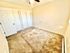 Bright and spacious bedroom with plush carpet and double closet doors.
