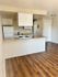 Updated white kitchen in an open floor plan