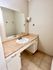 Elegant bathroom vanity with a sleek marble countertop and modern faucet.