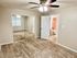 Inviting bedroom with plush carpet, large mirrored closet doors, and an ensuite bathroom.