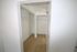 Spacious walk-in closet with ample shelving and modern design.