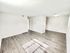 Bright, spacious room with modern hardwood flooring and neutral walls, perfect for a versatile living space.