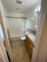 Bright and inviting bathroom featuring a sleek bathtub, modern showerhead, elegant sink, and tiled flooring.
