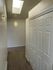 Bright hallway with a skylight and built-in closet, perfect for an inviting entryway.